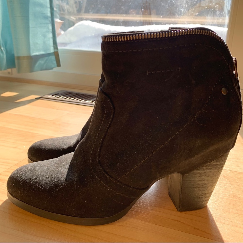 Black ankle boots with 3-inch block heel.